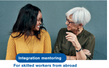 older and younger woman with text "integration mentoring"
